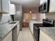 Updated kitchen featuring granite counters and stainless appliances at 2205 12Th Nw St, Winter Haven, FL 33881