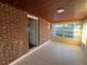 Bright sunroom with brick walls and tile floor, offering ample natural light at 2205 12Th Nw St, Winter Haven, FL 33881