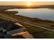 Aerial view of homes and lake at sunrise at 2271 Garden Belle Dr, Clermont, FL 34711