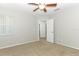 Bright bedroom featuring ceiling fan and access to hallway at 259 New Waterford Pl, Longwood, FL 32779