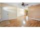 Bright living room with laminate wood floor and ceiling fan at 2714 Lakewood Ln, Eustis, FL 32726