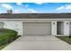 Tan garage door and exterior of the home at 2844 Grasmere View Pkwy, Kissimmee, FL 34746