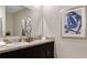 Double vanity bathroom with modern finishes and large mirror at 2936 Waterlily Way, Poinciana, FL 34759