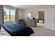 Spacious bedroom with sitting area and access to another room at 2936 Waterlily Way, Poinciana, FL 34759