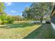 Peaceful backyard featuring a pond view and seating area at 4731 Larchmont Ct, Orlando, FL 32821