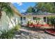 Front entrance and walkway surrounded by tropical landscaping at 4731 Larchmont Ct, Orlando, FL 32821