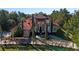 Luxury home with a red tile roof and lush green lawn at 502 W Lester Rd, Apopka, FL 32712