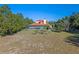 Large backyard with screened-in pool and patio at 502 W Lester Rd, Apopka, FL 32712