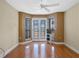 Bright bedroom with hardwood floors and French doors at 502 W Lester Rd, Apopka, FL 32712