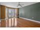 Spacious bedroom with hardwood floors and ceiling fan at 502 W Lester Rd, Apopka, FL 32712