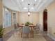 Bright dining room with a wooden table and neutral decor at 502 W Lester Rd, Apopka, FL 32712