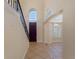 Grand entryway with a staircase and tile flooring at 502 W Lester Rd, Apopka, FL 32712