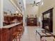 Open floor plan with a kitchen, fireplace, and bar at 502 W Lester Rd, Apopka, FL 32712