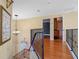 Upper hallway with hardwood floors and access to bedrooms at 502 W Lester Rd, Apopka, FL 32712