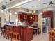 Modern kitchen with granite countertops and wood cabinets at 502 W Lester Rd, Apopka, FL 32712