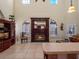 Living area with a fireplace and high ceilings at 502 W Lester Rd, Apopka, FL 32712