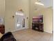 Bright living room with fireplace, TV, and French doors leading to patio at 502 W Lester Rd, Apopka, FL 32712