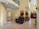 Two-story living room with open concept design at 502 W Lester Rd, Apopka, FL 32712