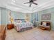 Spacious main bedroom with king-size bed and lots of natural light at 502 W Lester Rd, Apopka, FL 32712