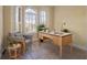 Home office with large desk, comfortable chair, and natural light at 502 W Lester Rd, Apopka, FL 32712