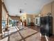 Outdoor kitchen area with tiled floor and mini fridge at 502 W Lester Rd, Apopka, FL 32712