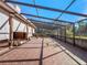 Spacious screened patio with tiled floor and backyard view at 502 W Lester Rd, Apopka, FL 32712