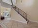 Elegant staircase with wrought iron railing at 502 W Lester Rd, Apopka, FL 32712