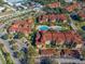 Aerial view of community featuring pool and parking at 5578 Metrowest Blvd # 101, Orlando, FL 32811
