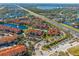 Aerial view of community by highway and lake at 5578 Metrowest Blvd # 101, Orlando, FL 32811