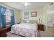 Spacious bedroom with a king-size bed and ensuite bathroom at 5578 Metrowest Blvd # 101, Orlando, FL 32811