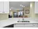 Modern kitchen with white cabinets and black appliances at 5578 Metrowest Blvd # 101, Orlando, FL 32811