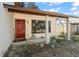 Home entrance with red door and covered porch at 986 Finrod Way, Casselberry, FL 32707