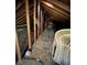 Unfinished attic space with wooden beams and flooring at 14521 E Highway 316, Fort Mc Coy, FL 32134