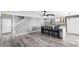 Modern kitchen with an island, stainless steel appliances, and gray flooring at 15321 Beamleigh Rd, Winter Garden, FL 34787