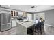 Modern kitchen with white cabinets, granite countertops, and stainless steel appliances at 15321 Beamleigh Rd, Winter Garden, FL 34787