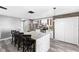Modern kitchen with white cabinets, granite countertops, and island seating at 15321 Beamleigh Rd, Winter Garden, FL 34787