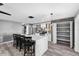 Modern kitchen with white cabinets, granite countertops, and island seating at 15321 Beamleigh Rd, Winter Garden, FL 34787