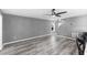 Bright living room featuring hardwood floors and a ceiling fan at 15321 Beamleigh Rd, Winter Garden, FL 34787