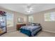 Bedroom with double bed, dresser, and plenty of natural light at 1813 Sugar Cove Ct, Ocoee, FL 34761