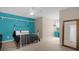Bedroom with teal accent wall and a comfortable bed at 1813 Sugar Cove Ct, Ocoee, FL 34761