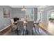 Elegant dining room featuring a wood table and six upholstered chairs at 1813 Sugar Cove Ct, Ocoee, FL 34761
