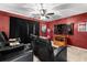 Home theater with comfortable seating and large screen TV at 1813 Sugar Cove Ct, Ocoee, FL 34761