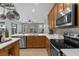 Updated kitchen featuring stainless steel appliances and wood cabinets at 1813 Sugar Cove Ct, Ocoee, FL 34761