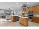 Well-equipped kitchen with stainless steel appliances and an island at 1813 Sugar Cove Ct, Ocoee, FL 34761