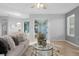 Spacious living room with a comfortable couch and access to a lanai at 1813 Sugar Cove Ct, Ocoee, FL 34761