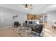 Open living room with a view into the kitchen and a cozy seating area at 1813 Sugar Cove Ct, Ocoee, FL 34761