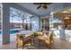 Covered patio with wicker furniture, overlooking the pool at 1813 Sugar Cove Ct, Ocoee, FL 34761