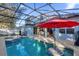 Refreshing pool and spa with a convenient swim-up bar at 1813 Sugar Cove Ct, Ocoee, FL 34761