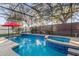 Inviting swimming pool with spa and screened enclosure at 1813 Sugar Cove Ct, Ocoee, FL 34761