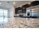 Granite countertop kitchen island with stainless steel appliances at 1839 Overcup Ave, Saint Cloud, FL 34771